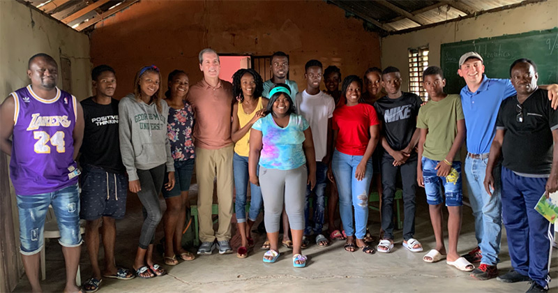 Dr. Rick Green, center left, visits a Dominican Republic Community as part of a Rotary Club of Vancouver clean water project.